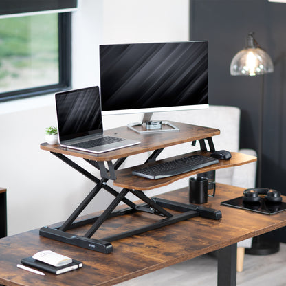 Sturdy height adjustable 2-tiered rustic desk riser for ergonomic office workstation.