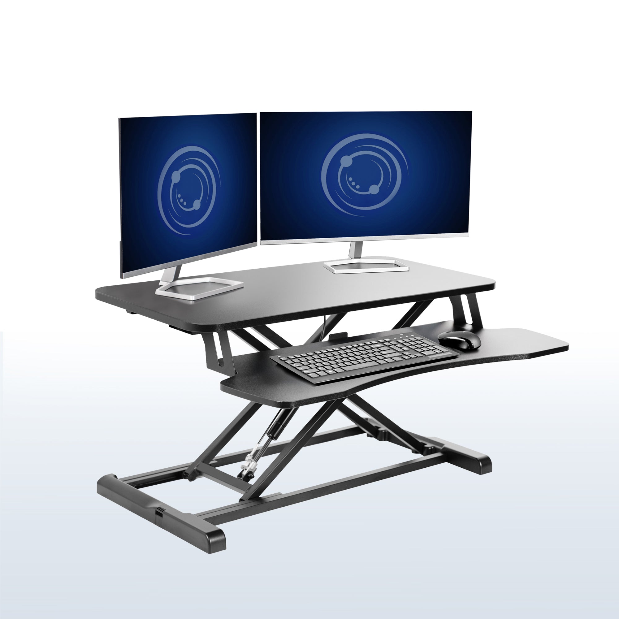 Sturdy height adjustable 2-tiered desk riser for ergonomic office workstation in  office setting. 