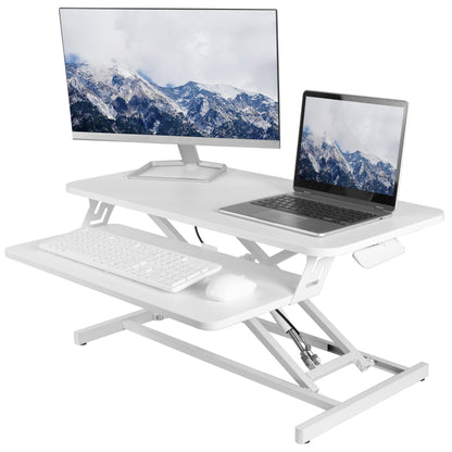 Heavy-duty height adjustable desk converter monitor riser with 2 tiers.