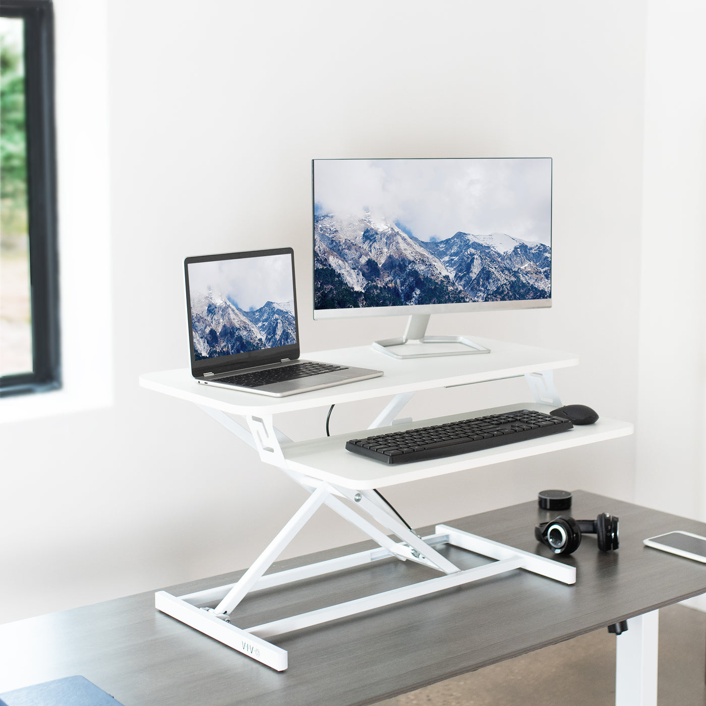 Modern and ergonomic designed office space with desk converter.