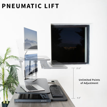 Heavy-duty height adjustable desk converter monitor riser with 2 tiers.