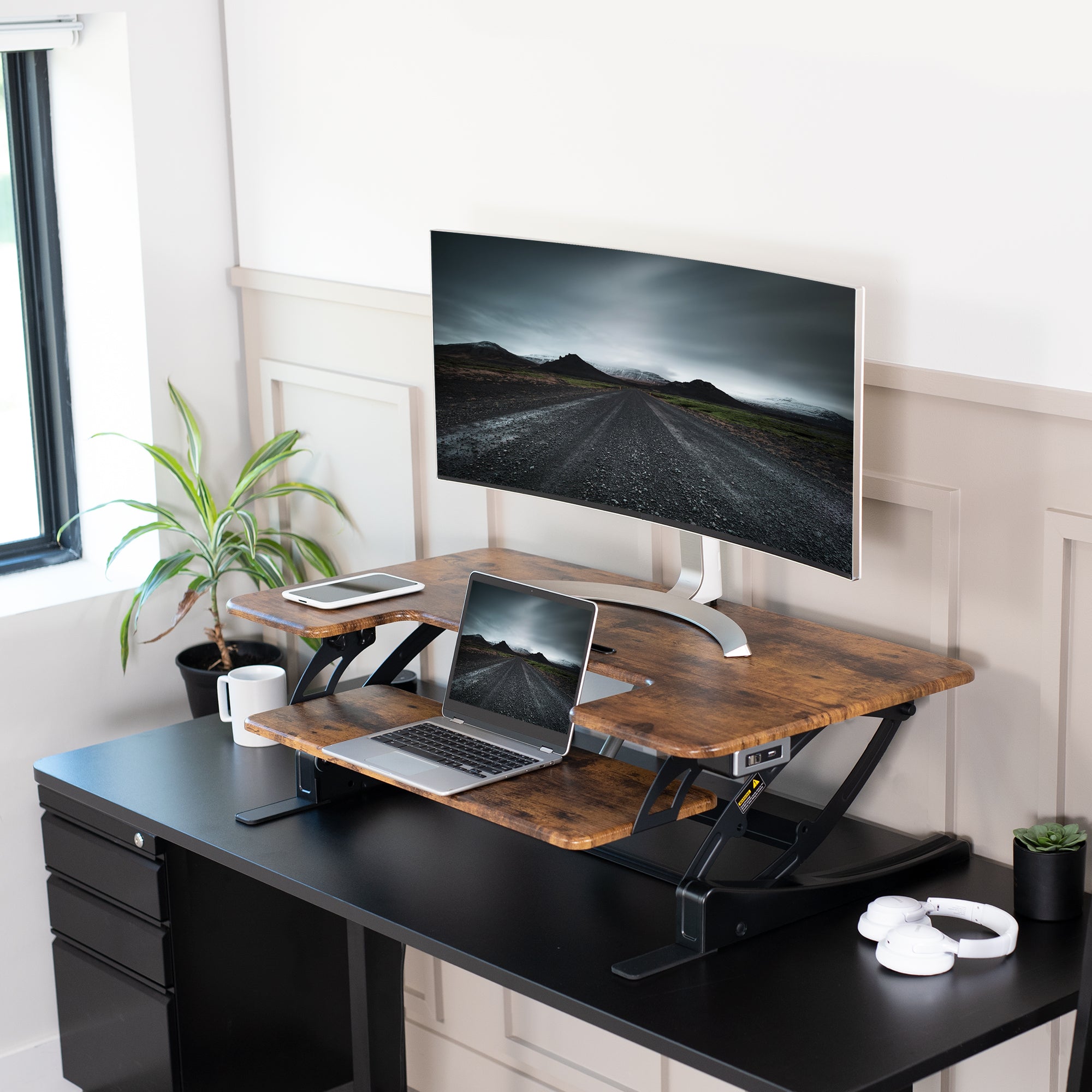 Top view of a rustic desk converter on a desk in a furnished office space.