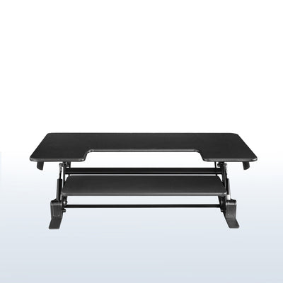 Dual-tier pneumatic assist desk converter with keyboard and mouse tray.