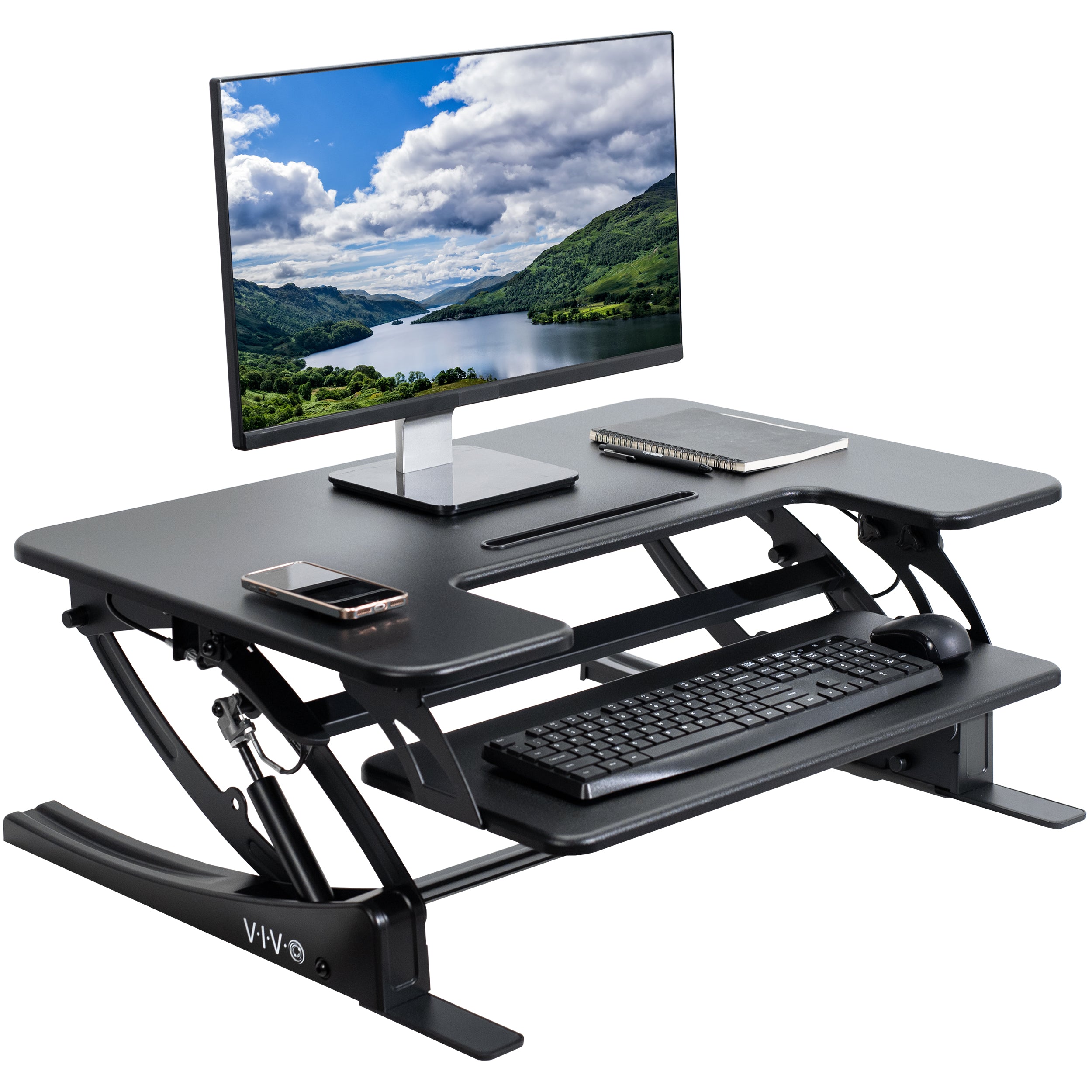 Heavy-duty height adjustable desk converter monitor riser with two tiers.