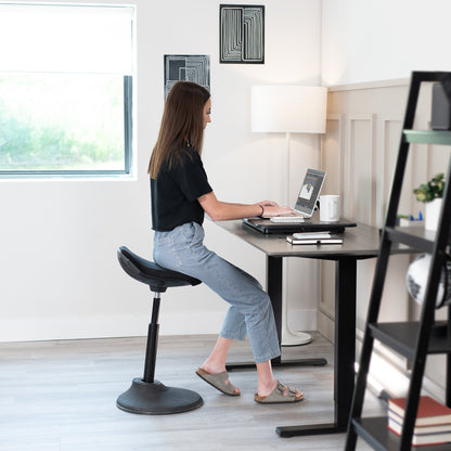 A desk riser you can work from while sitting or standing.