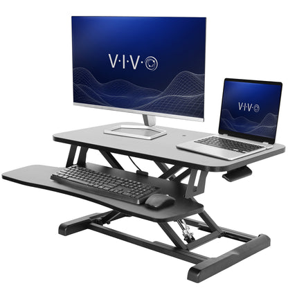 Sturdy height adjustable 2-tiered desk riser for ergonomic office workstation.