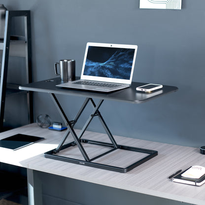 Heavy-duty height adjustable desk converter monitor riser.