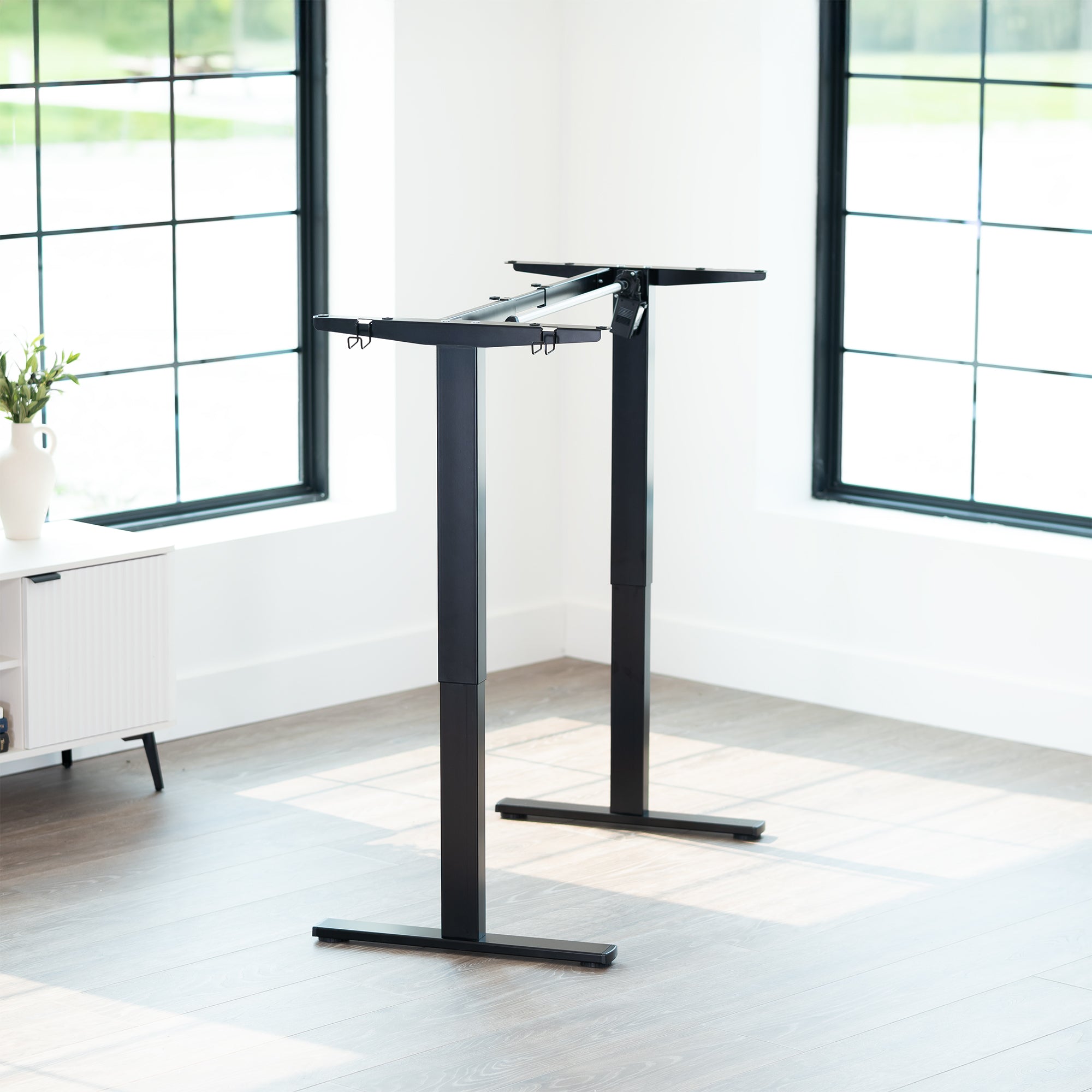 Sturdy ergonomic sit or stand desk frame for active workstation with adjustable height using smart control panel.