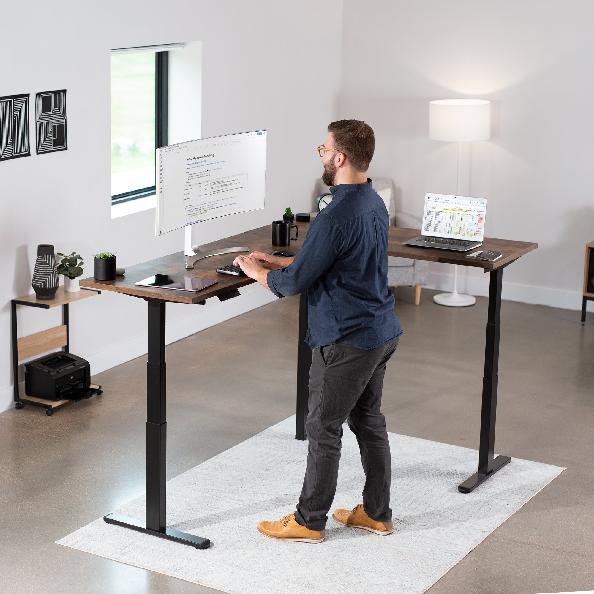 Large L-shaped desk in a modern minimalist room.