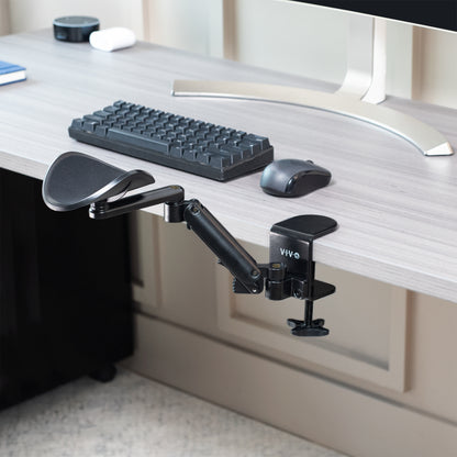 Ergonomic adjustable rotating clamp-on armrest for extra arm support while working.