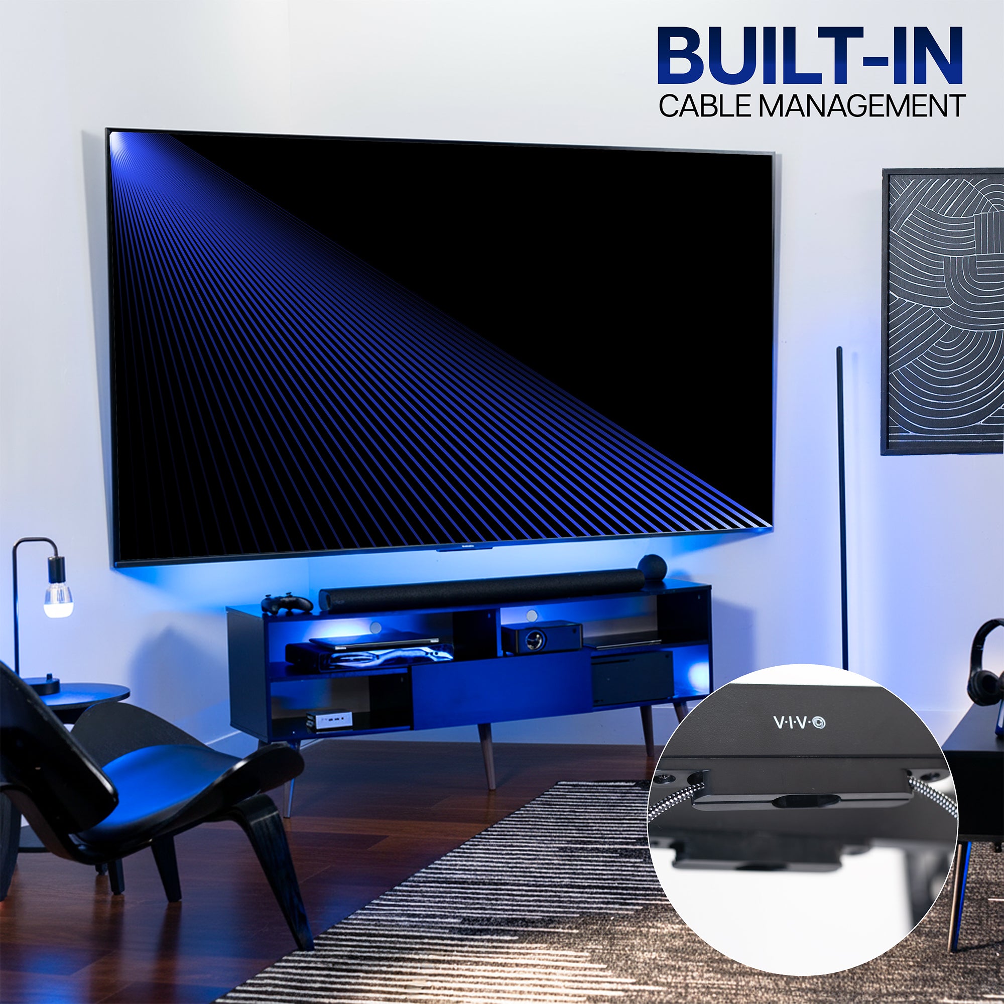 Living room with a large TV on a corner wall mount with a built-in cable management system.