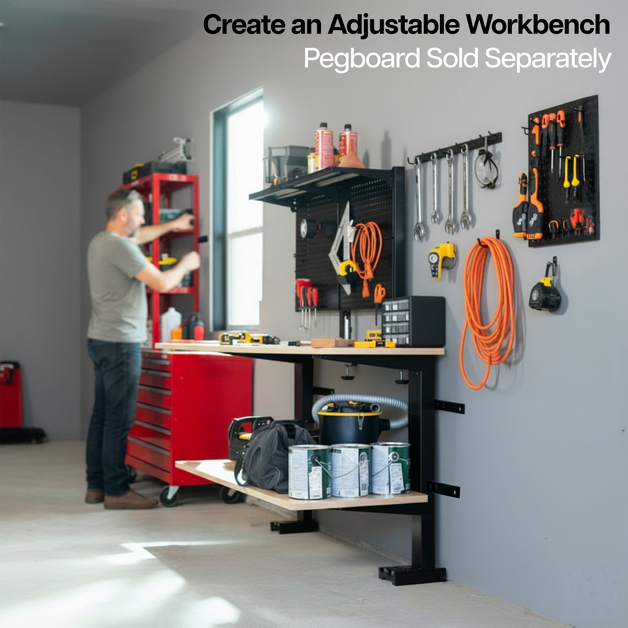 Garage setup with adjustable workbench, tools, and storage solutions.