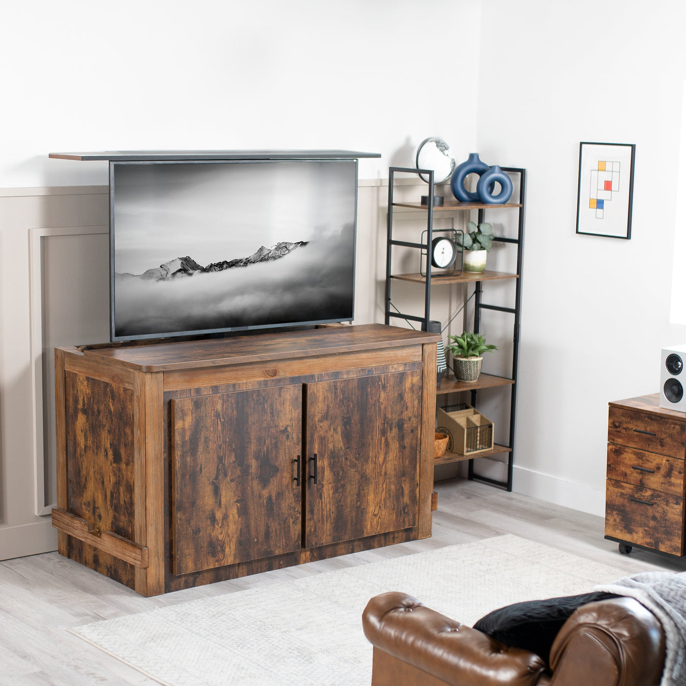 Motorized TV Stand with Remote Control coming out of a cabinet in living room.