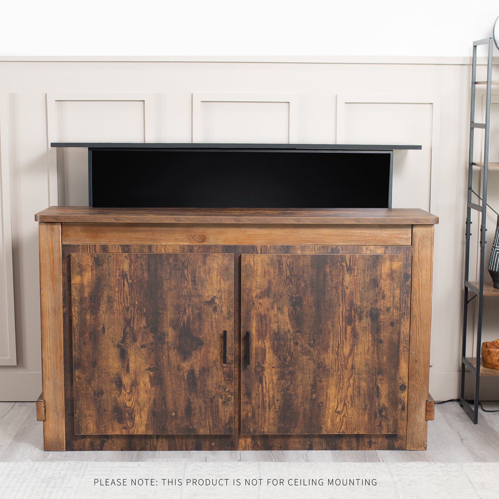 Wooden entertainment console with TV concealed in living room setting. 
