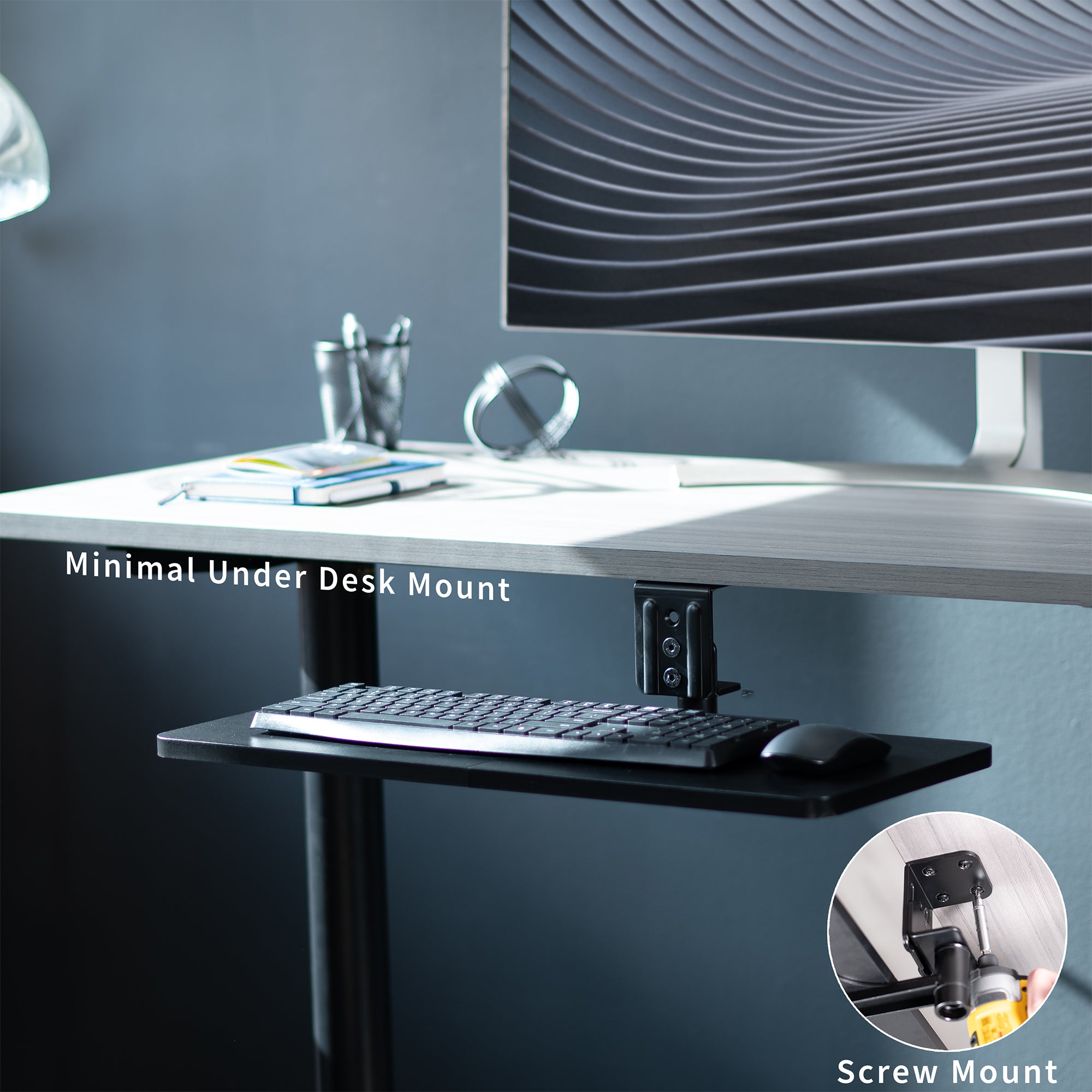 Low-profile under desk keyboard tray with 360-degree rotation.