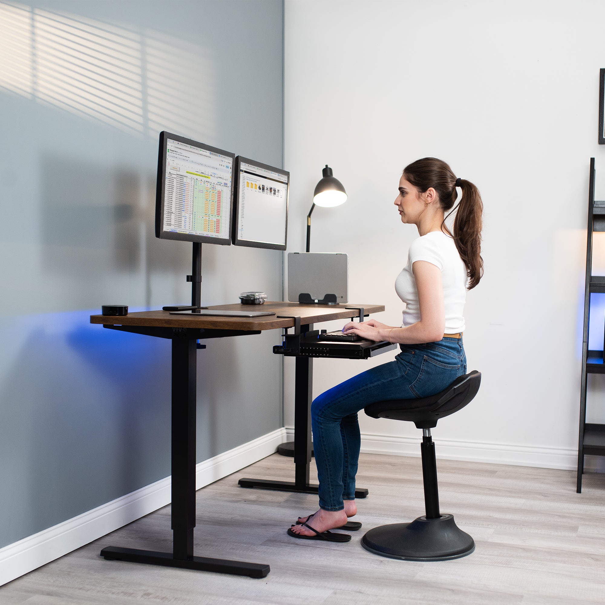 Clamp-on keyboard tray with pencil drawer for convenient space-saving desk workstation.