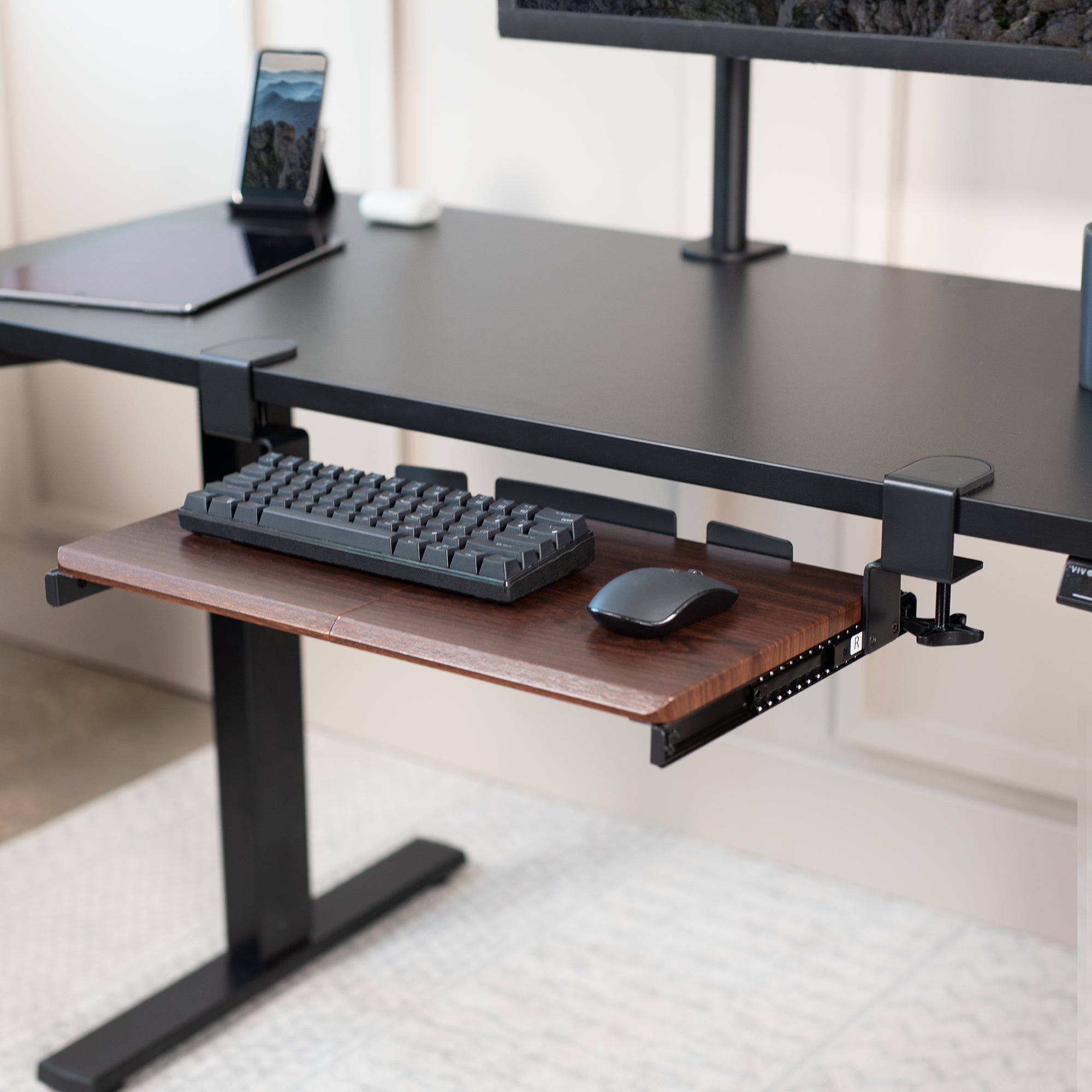 Compact clamp-on pullout keyboard tray.