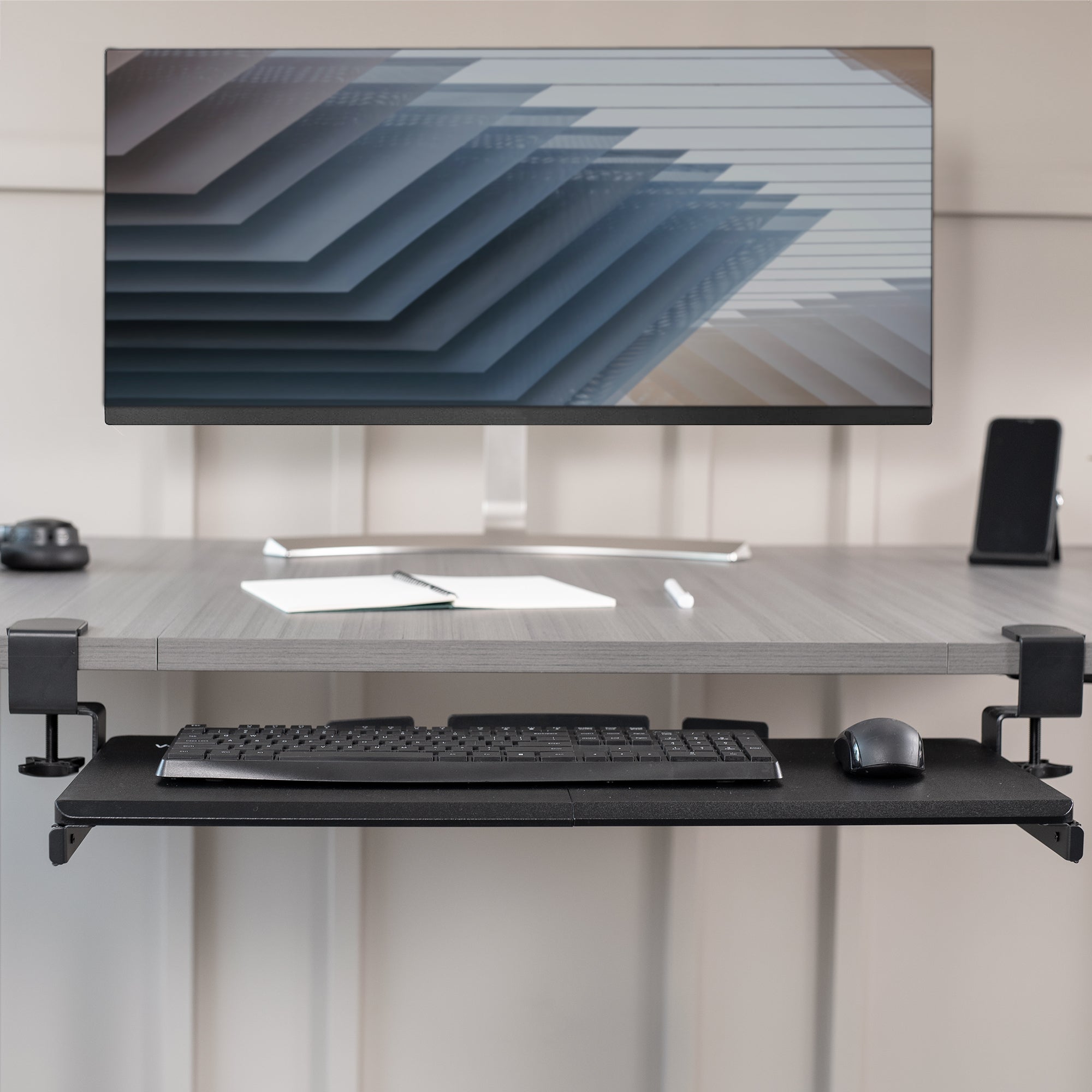 Sleek design with C-clamps and sliding tray for a clean and tidy workstation.