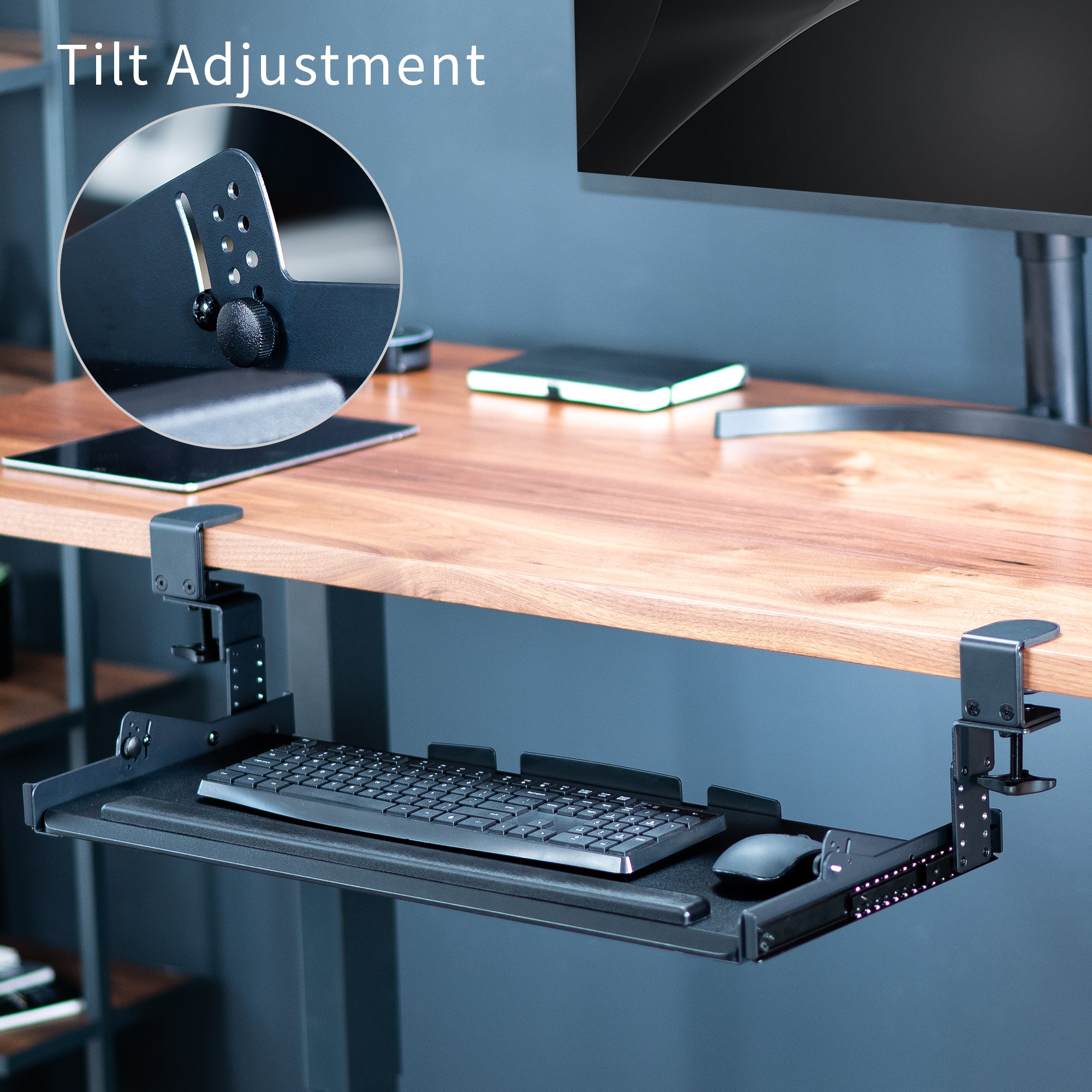 Modern pull-out clamp-on height adjustable tilting keyboard tray. Clamps can swivel to accommodate corner desk setups.