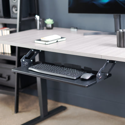 Office workstation desk setup featuring spacious under-desk keyboard tray.