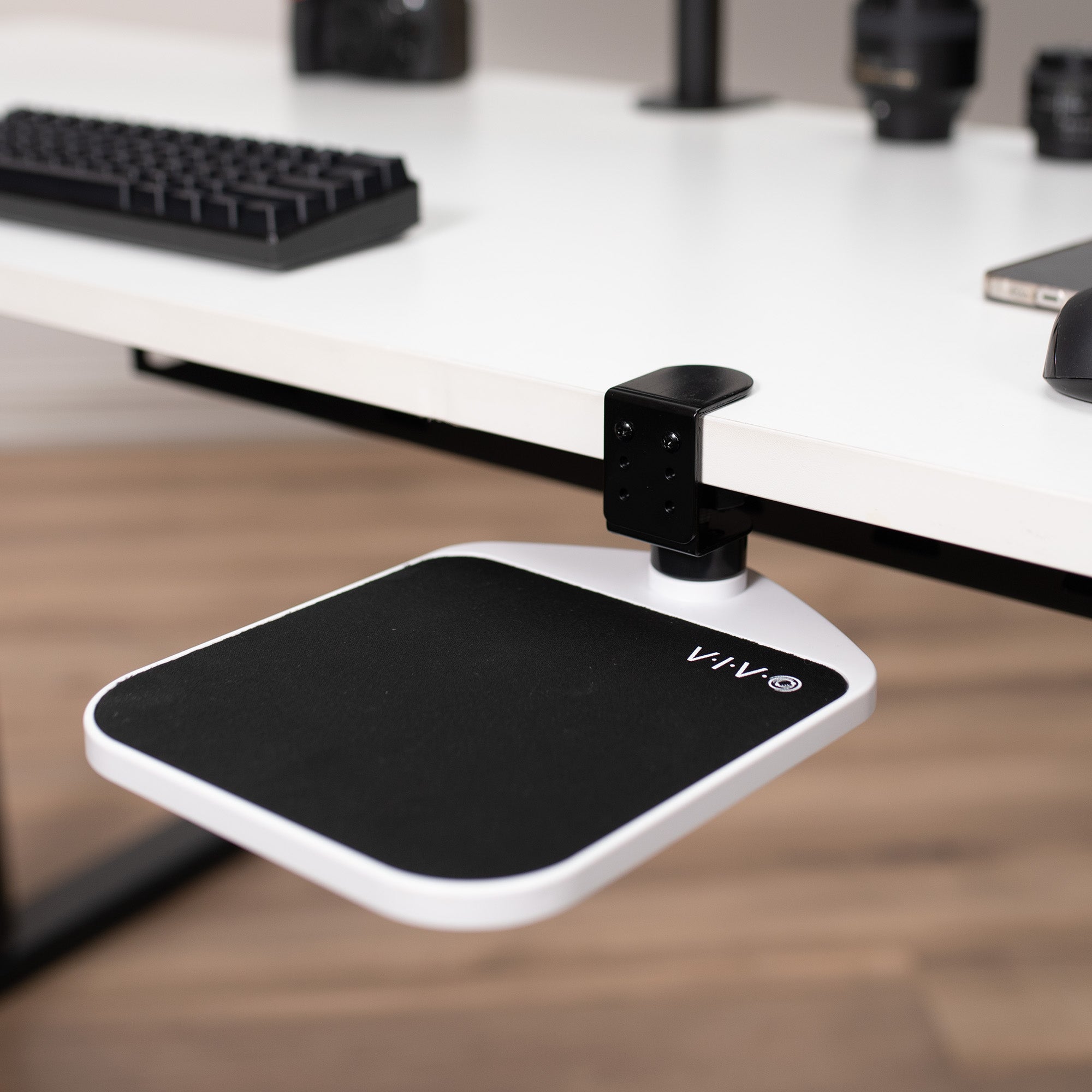 Ergonomic clamp-on mouse pad platform adjustable attachment for desk.