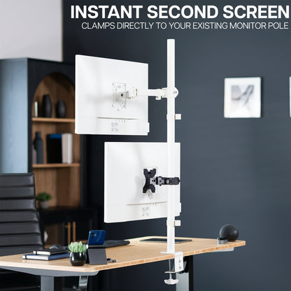 Desk setup with a monitor stand and additional screen attachment via the VESA pole mount bracket in an office setting.