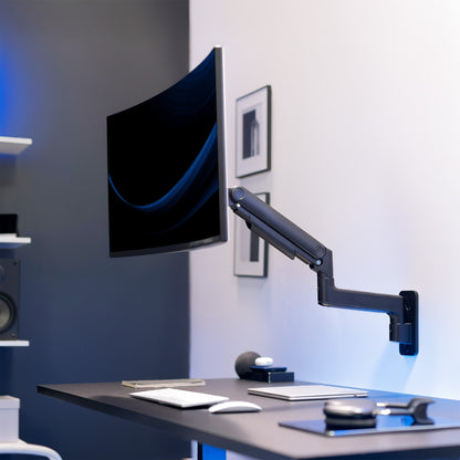 Monitor on a Pneumatic Arm Ultrawide Monitor Desk Mount in a home office setting