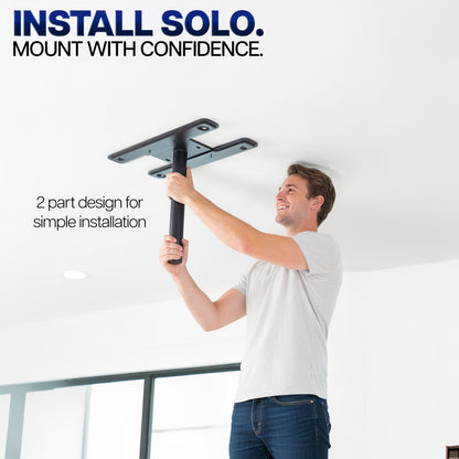 Person installing a Hanging Quad TV Ceiling Mount with text 'Install Solo' and 'Mount with Confidence'.