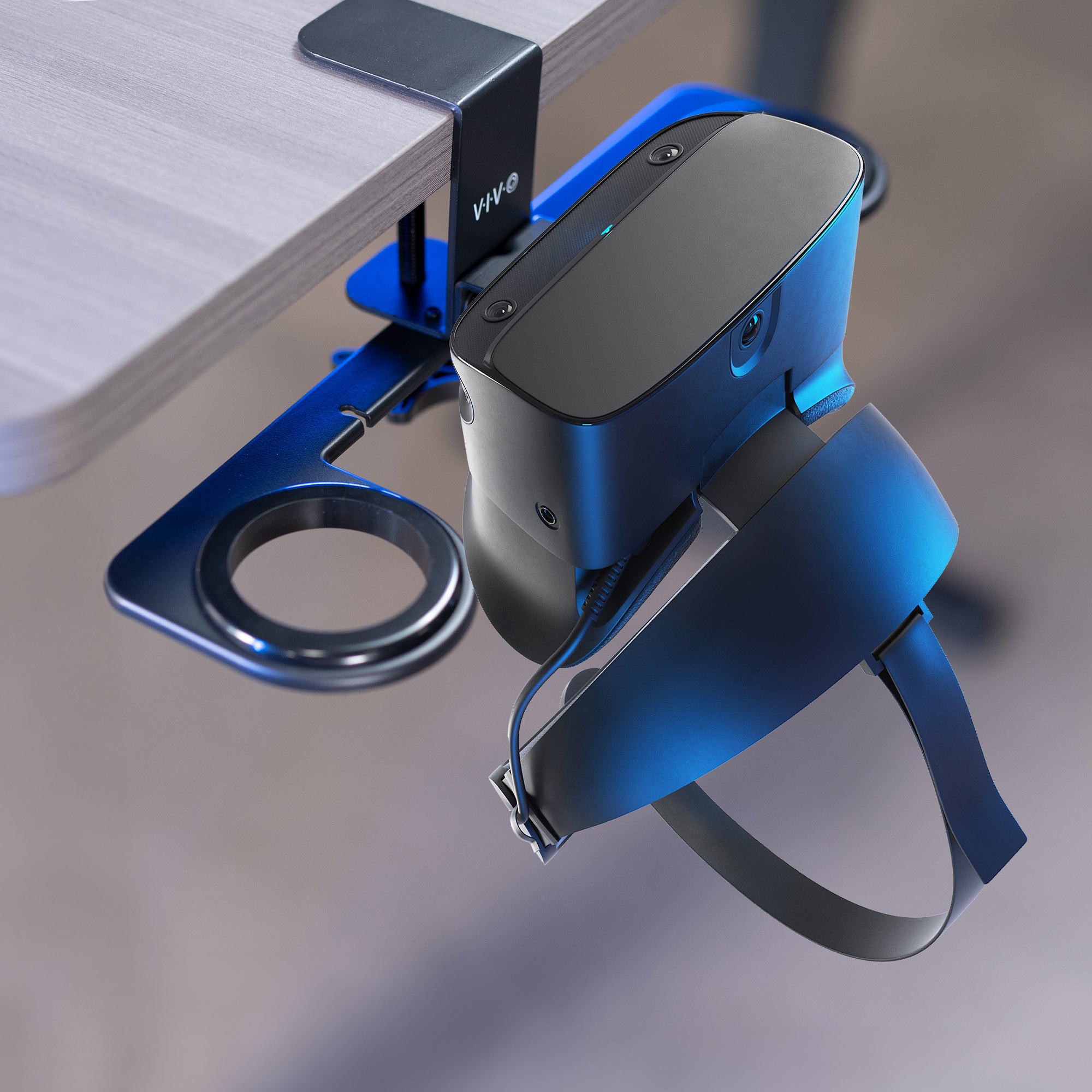 Clamp-on VR headset stand that mounts to desk for storage and convenient access.