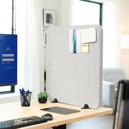 Desk Privacy Panel on a wooden desk with a computer monitor, keyboard, and office supplies.