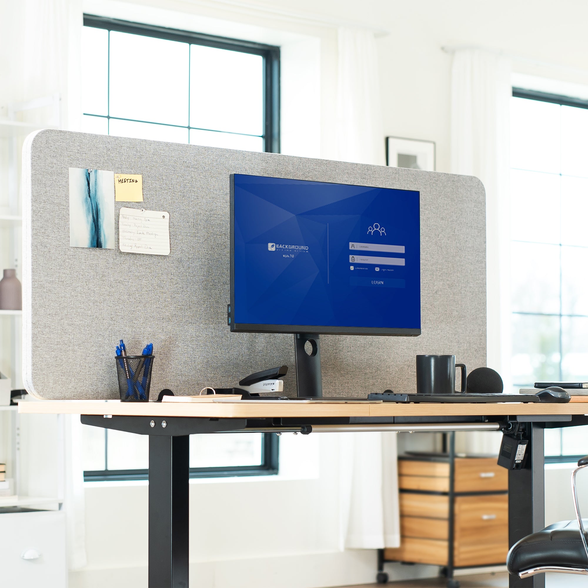 Desk setup with a computer monitor, keyboard, and mouse in an office setting with Privacy Panel.