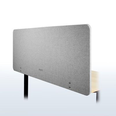 Clamp-on desk privacy panel for office workspace.
