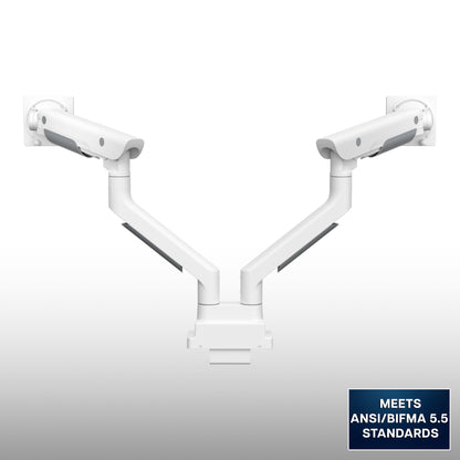 A premium, dual-arm white monitor mount, shown on a light gray gradient background with a blue compliance badge in the bottom right corner.