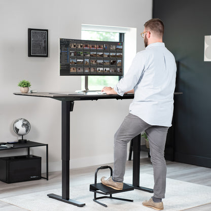 Adjustable footrest designed for workers who sit or stand all day with little ergonomic support.