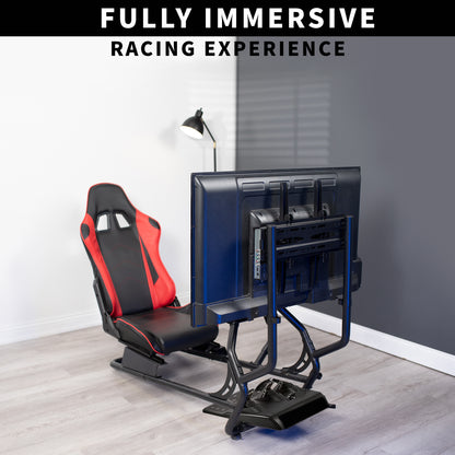 Gaming simulator setup with red and black chair, multiple monitors, and steering wheel on a wooden floor.