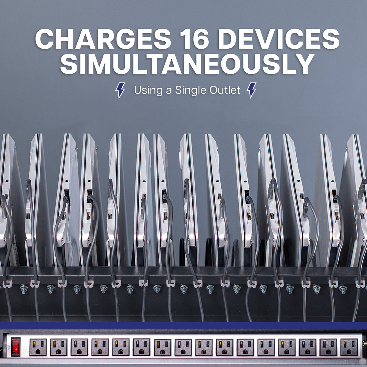 A 16-device holder with multiple vertical charging slots holding silver electronic devices, a front panel of multiple electrical outlets, and bold text at the top reading 'CHARGES 16 DEVICES SIMULTANEOUS' and 'Using a Single Outlet'.