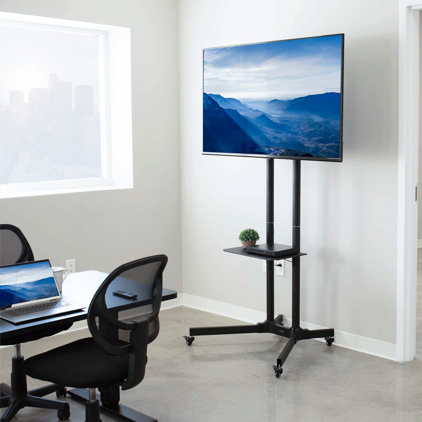 Mobile TV cart in an office meeting room.