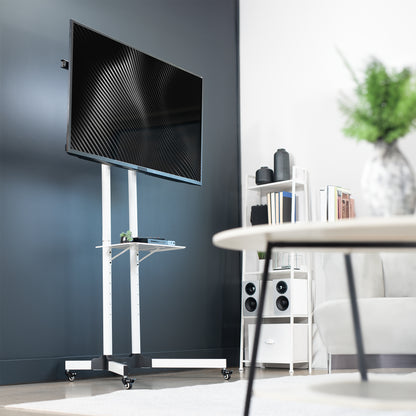 Mobile TV cart displays large screen on rolling stand for ergonomic viewing.