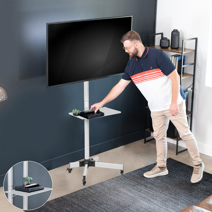 Mobile TV cart displays large screen on rolling stand for ergonomic viewing.