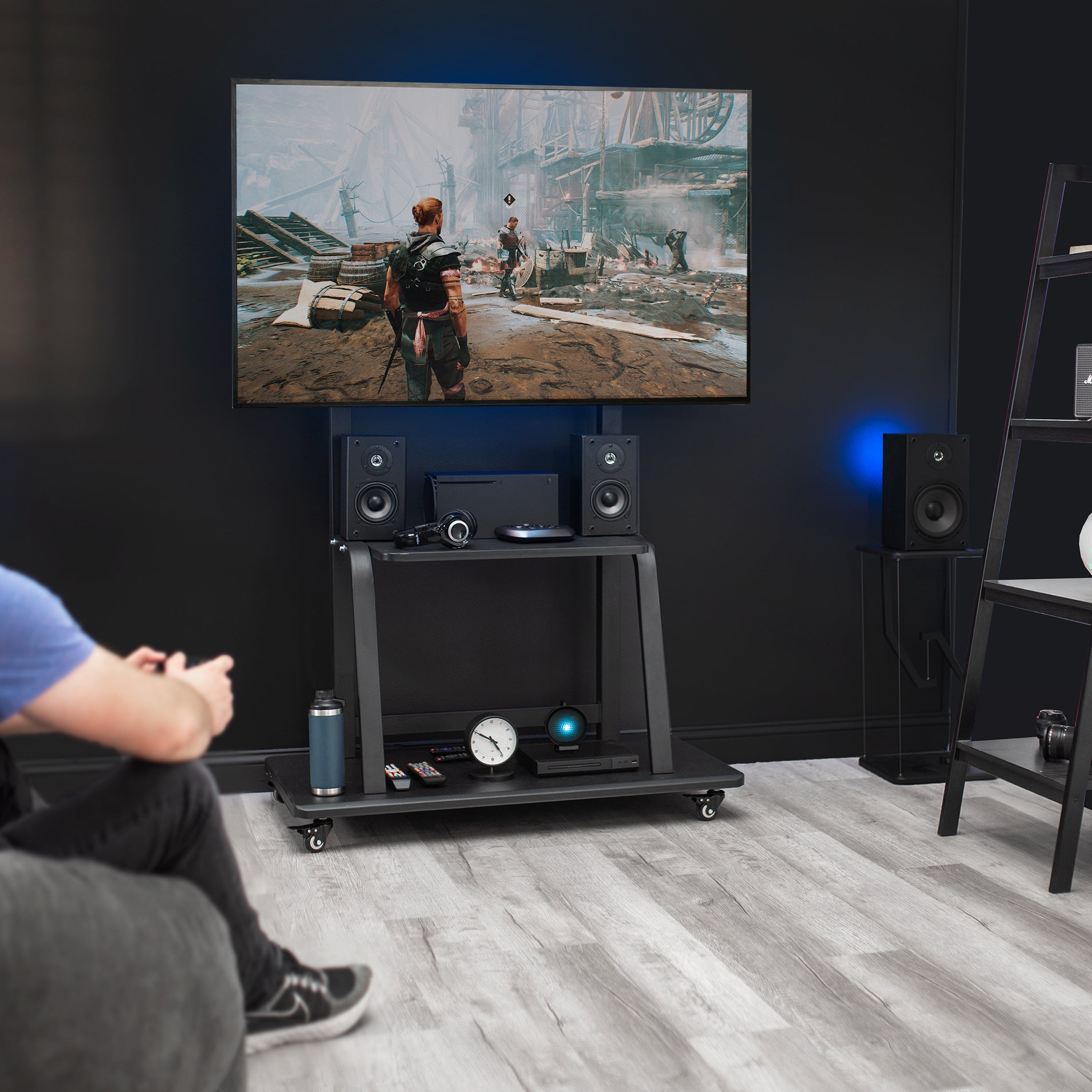 TV stand with a stable base and locking caster wheels.