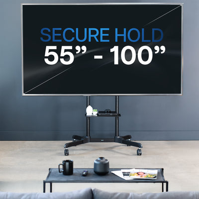 Mobile TV mount cart with media shelf and locking wheels. Stand features height adjustment, articulation, and a built-in cable management system.