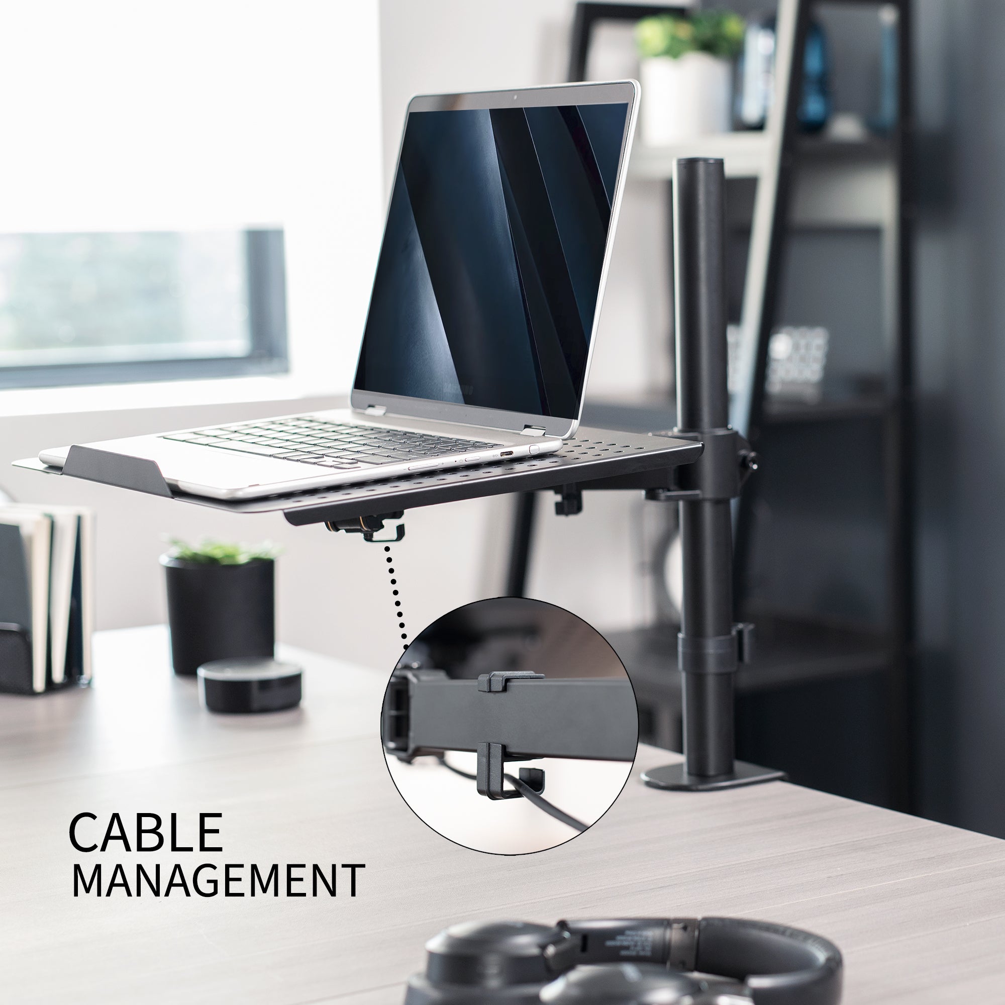 Height adjustable clamp-on laptop stand with ventilation and cable management.