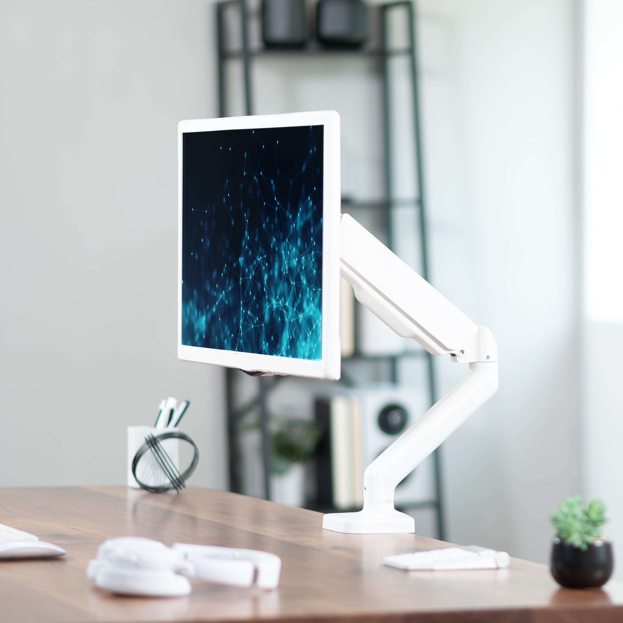 Sturdy clamp-on mechanical arm single monitor desk mount with articulation, height adjustment, and cable management.