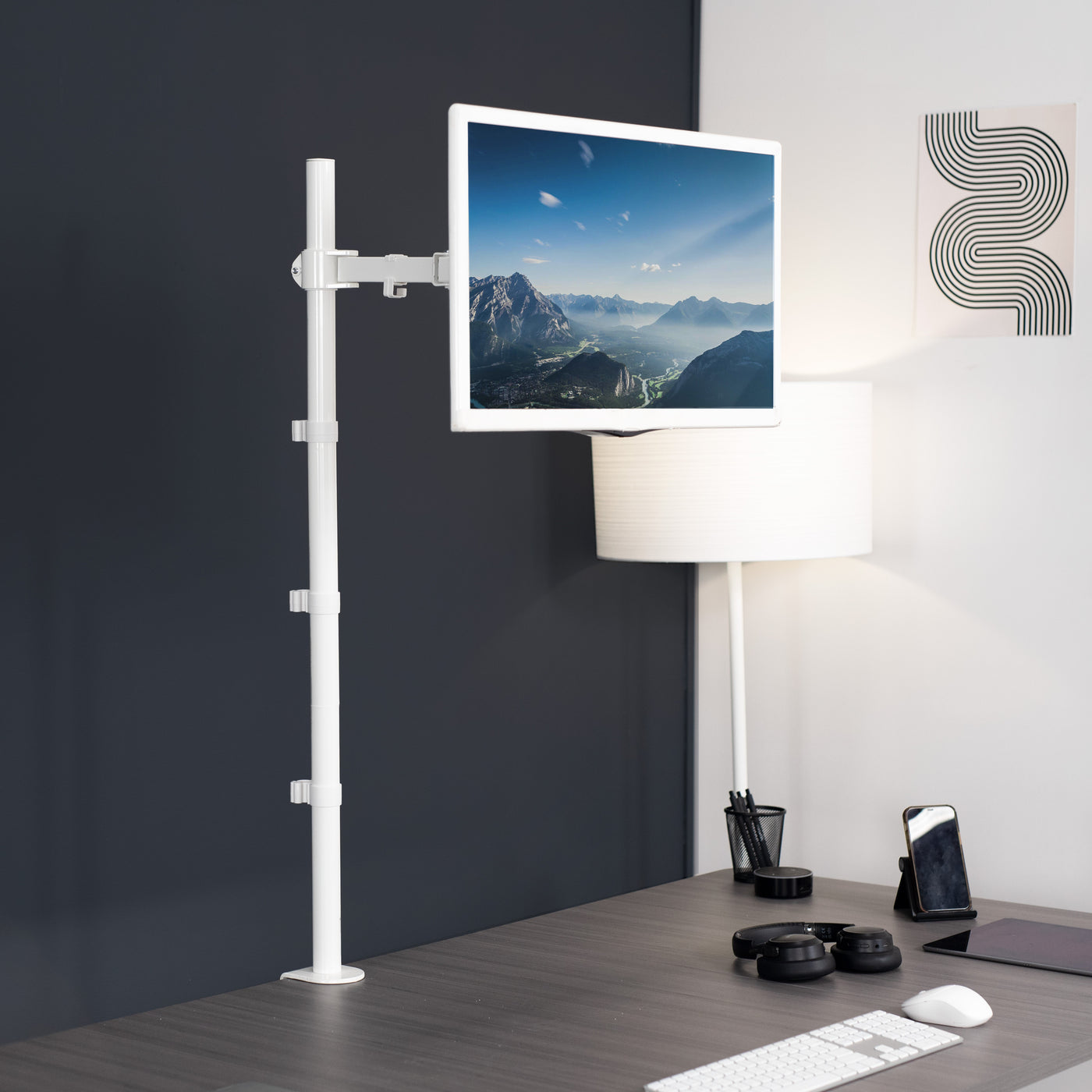 Extra tall desk mount for single monitor provides sit or stand application for the user.