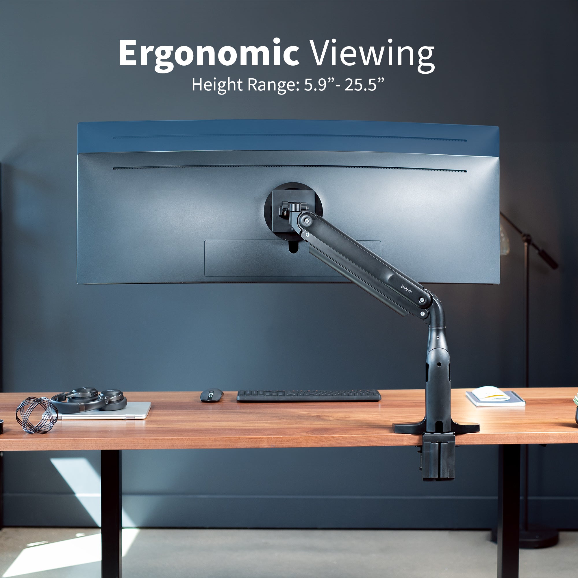 Ergonomic pneumatic arm with mounted ultrawide monitor.