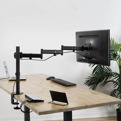 Single Monitor Desk Mount with Extra Long Arm mounted to desk in home office setting