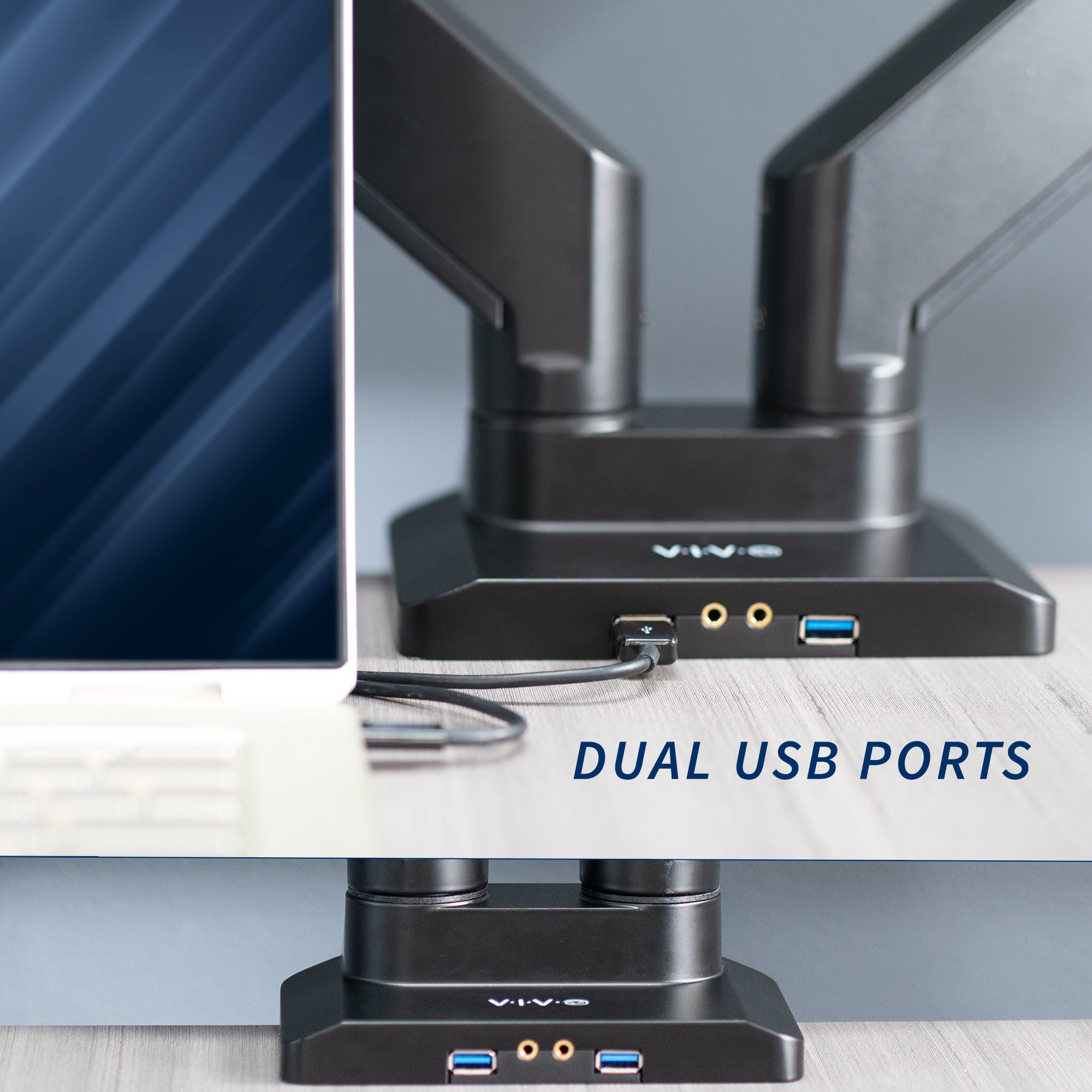 Adjustable pneumatic dual monitor desk mount with USB ports for ultrawide monitors.