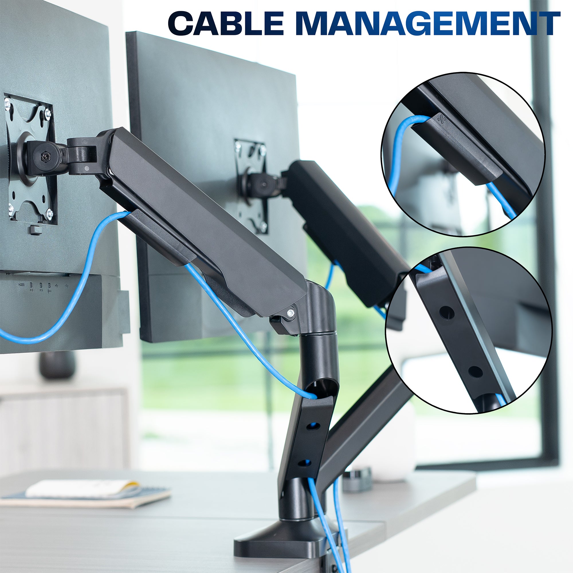 Monitor arm with cable management feature on a desk setup.