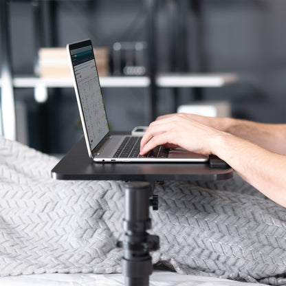 Height adjustable swiveling under mattress overbed desk tray. Rotation and tilt allow for convenient, versatile use. Wrist padding makes typing comfortable.