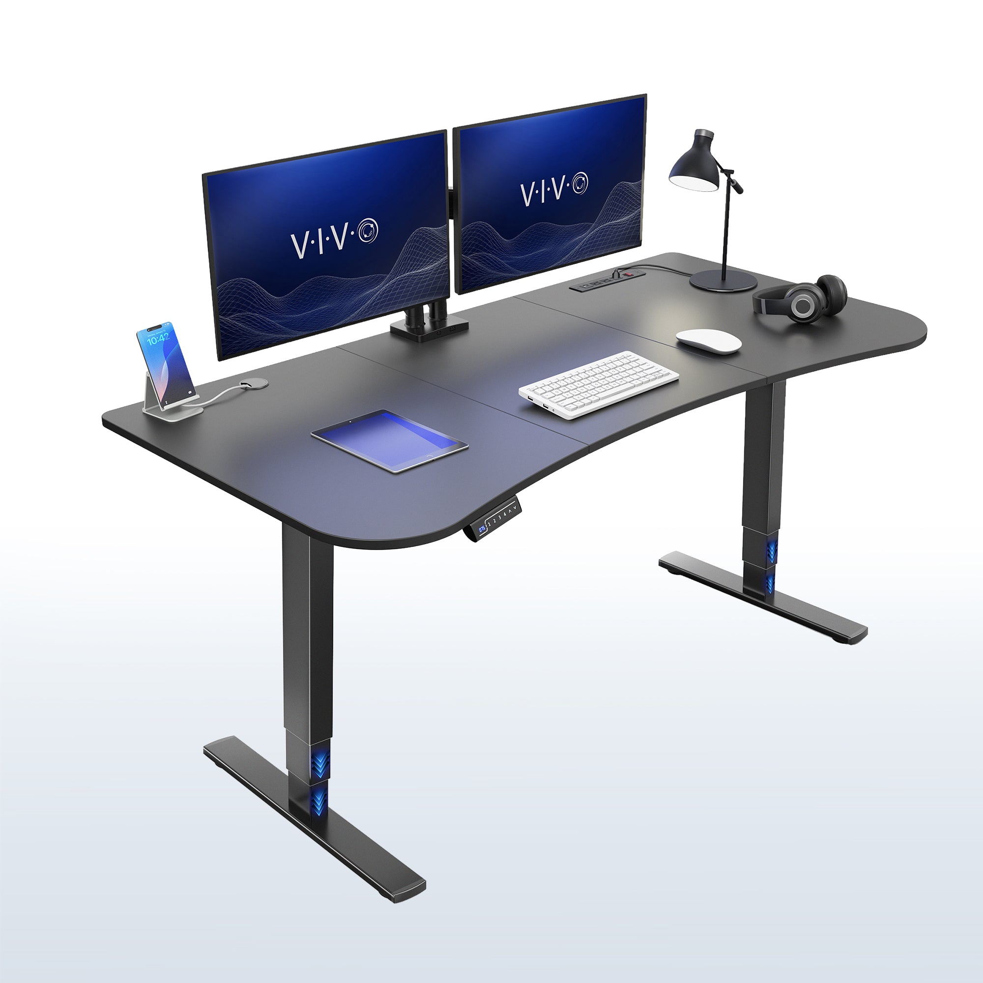 63” x 32” Electric Height Adjustable Stand Up Desk. Features a built-in power strip.